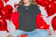 XOXO The Original Love Letters Tee Crown of Thorns Shirt on model surrounded by red heart balloons.