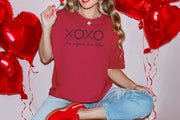 XOXO The Original Love Letters Tee Crown of Thorns Shirt worn with red heart balloons in background, perfect for Valentine's Day.