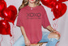 XOXO The Original Love Letters Tee Crown of Thorns Shirt worn by model with heart balloons.