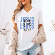 Jesus Loves You & Me T-shirt featuring John 15:13 design on a white V-neck tee, perfect for casual wear and faith events.