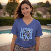 Jesus Loves You & Me T-shirt worn by a smiling woman in a blue V-neck, featuring John 15:13.
