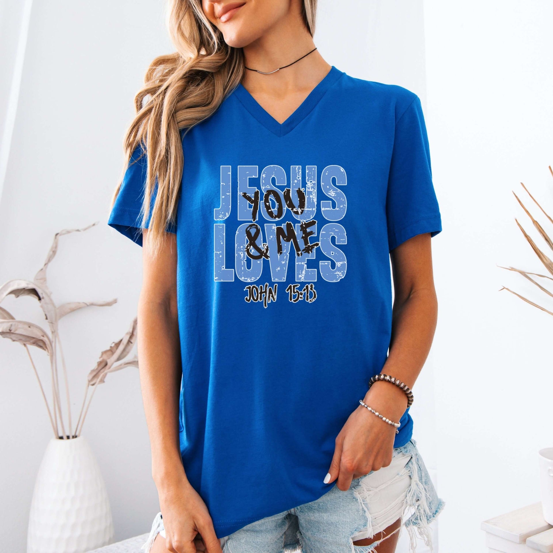 Jesus Loves You & Me T-shirt featuring a blue V-neck design inspired by John 15:13, perfect for everyday wear.
