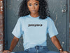 Jesus Loves Me Unisex T-shirt worn by a woman, showcasing a relaxed fit and faith-based graphic design.