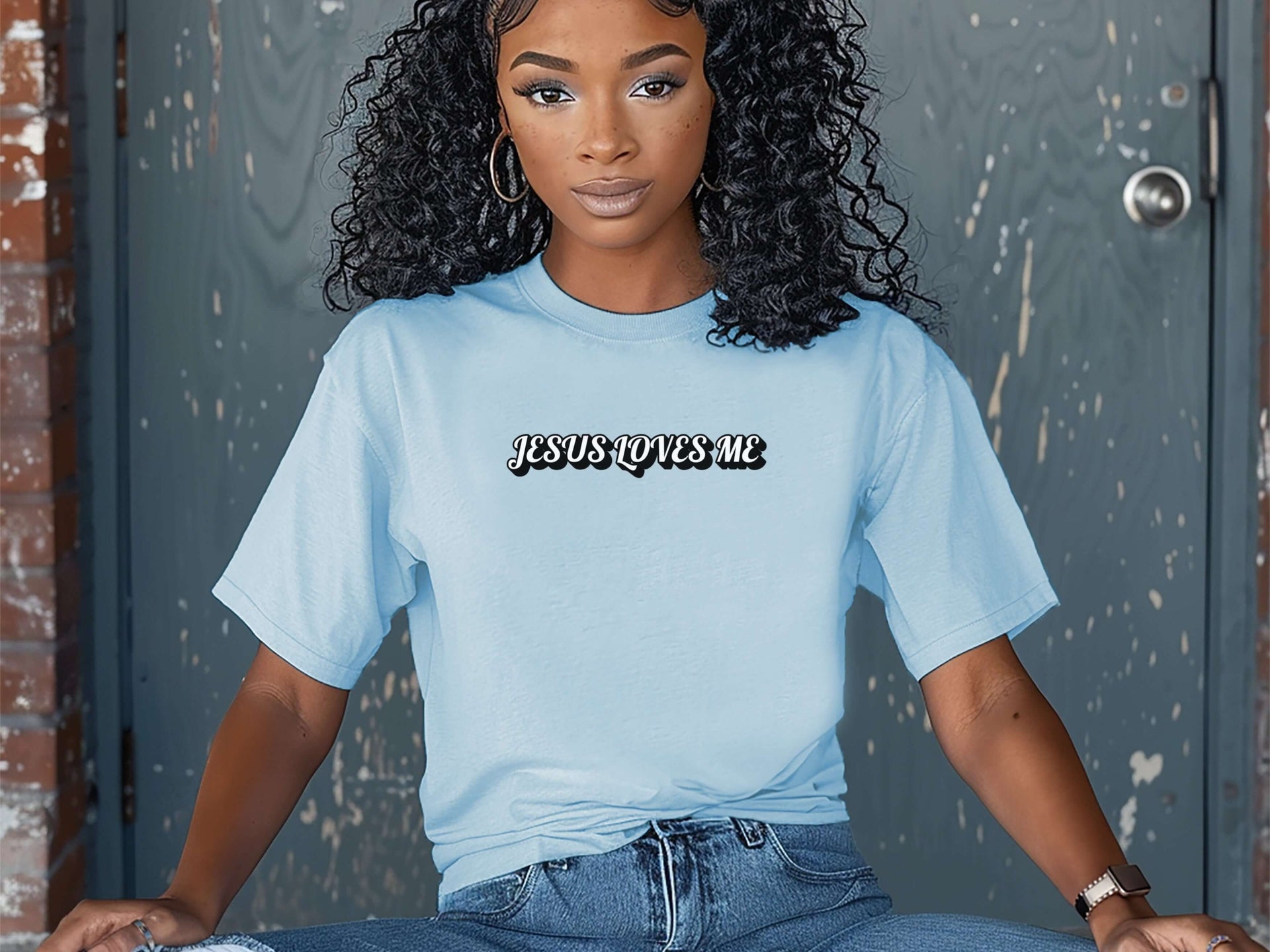 Jesus Loves Me Unisex T-shirt worn by a woman, showcasing a relaxed fit and faith-based graphic design.