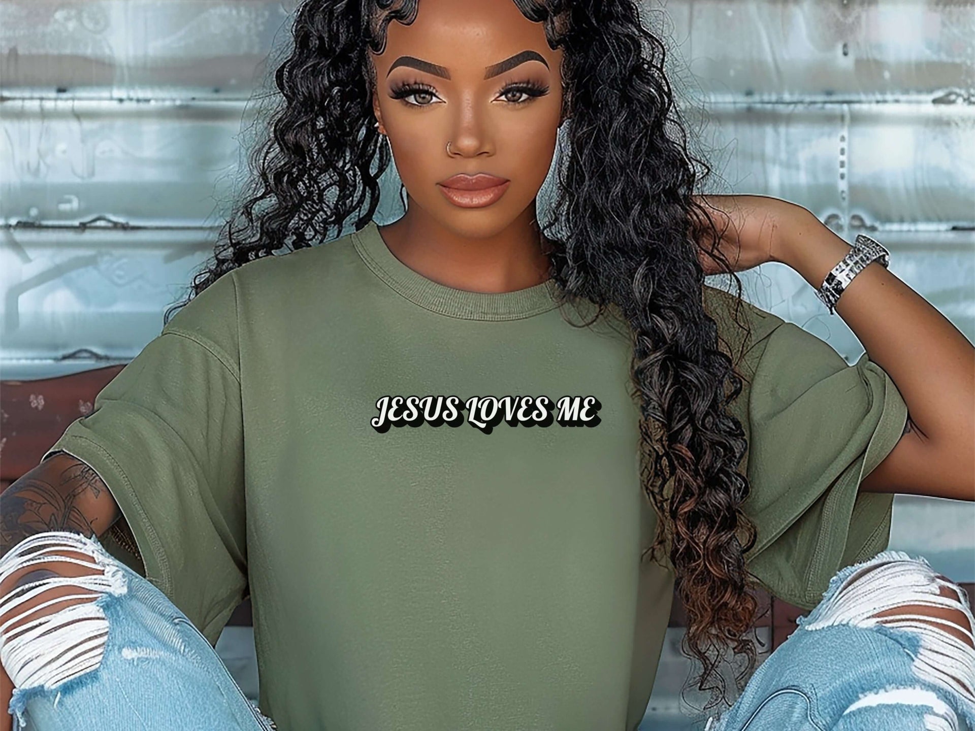 Jesus Loves Me Unisex T-shirt worn by a model with curly hair, featuring a simple faith graphic in a casual setting.