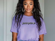 Model wearing a purple Jesus Loves Me Unisex T-shirt, showcasing faith-inspired graphic design and relaxed fit.