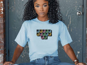 Jesus Loves Me Unisex T-Shirt featuring keyboard keys graphic on a woman sitting casually.