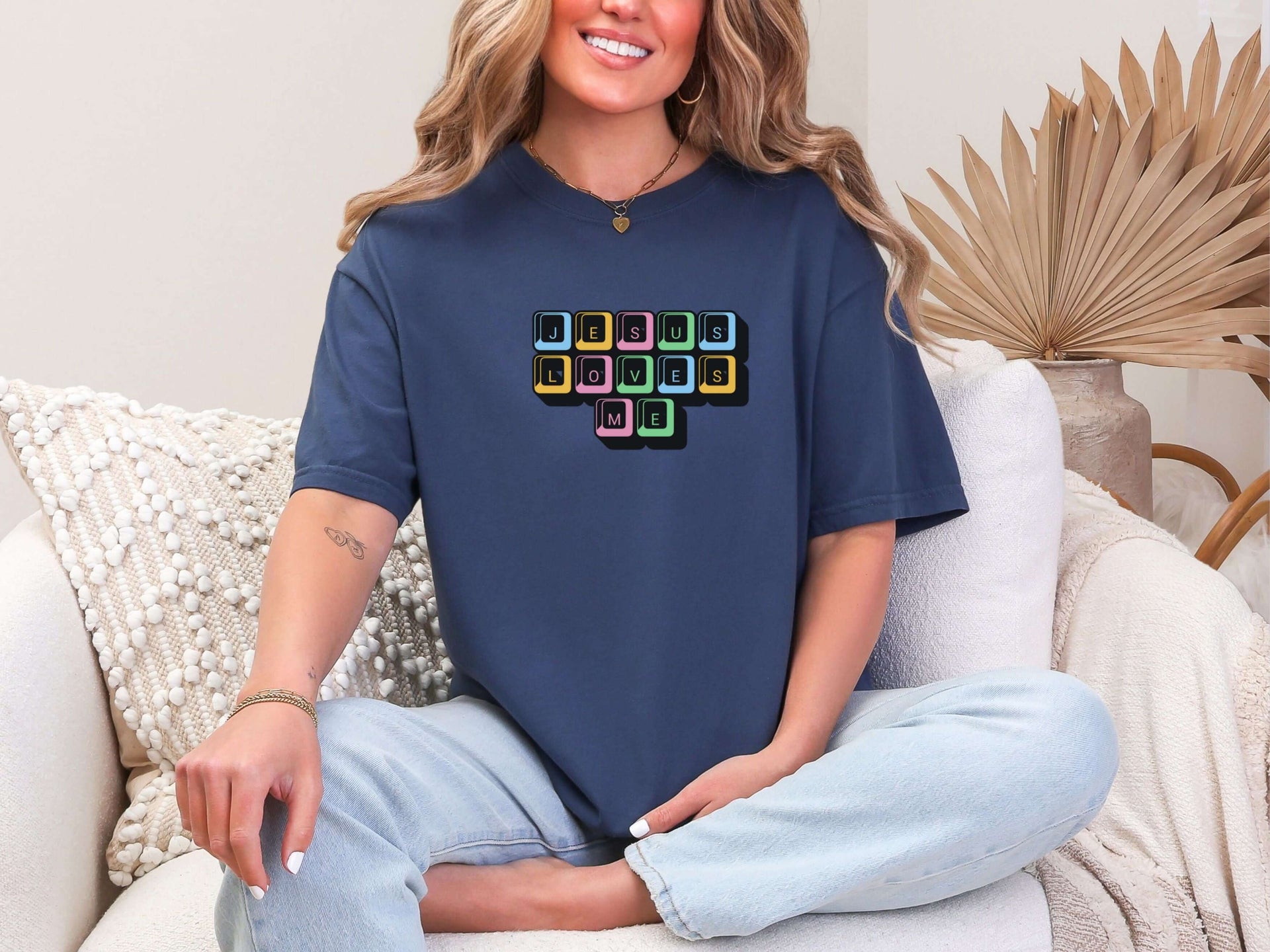 Jesus Loves Me Unisex T-Shirt featuring keyboard keys graphic on a relaxed fit navy tee.
