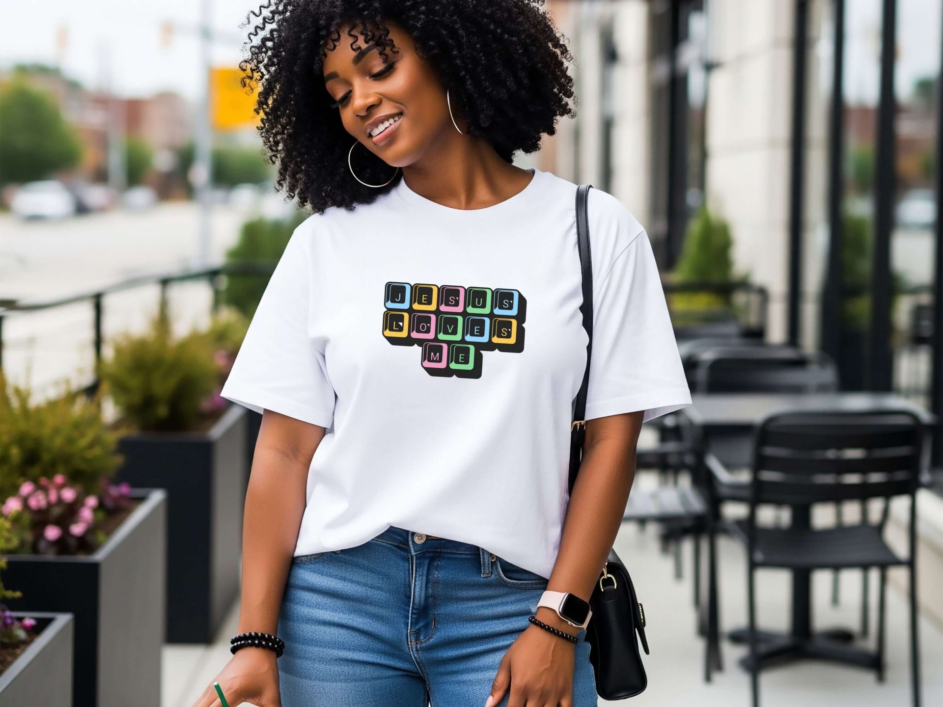 Jesus Loves Me Unisex T-Shirt featuring keyboard keys graphic on a stylish model outdoors