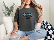 Woman wearing Jesus Loves Me Unisex T-Shirt with keyboard keys graphic, stylish and comfortable for everyday wear.