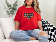 Jesus Loves Me Unisex T-Shirt styled with keyboard keys graphic on a relaxed red tee.