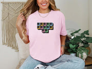 Jesus Loves Me Unisex T-Shirt featuring a keyboard keys graphic design on a blossom tee.