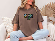 Jesus Loves Me Unisex T-Shirt featuring keyboard keys graphic on a relaxed-fit espresso tee worn by a smiling model.