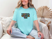 Jesus Loves Me Unisex T-Shirt featuring keyboard keys graphic, modeled by woman in casual setting.