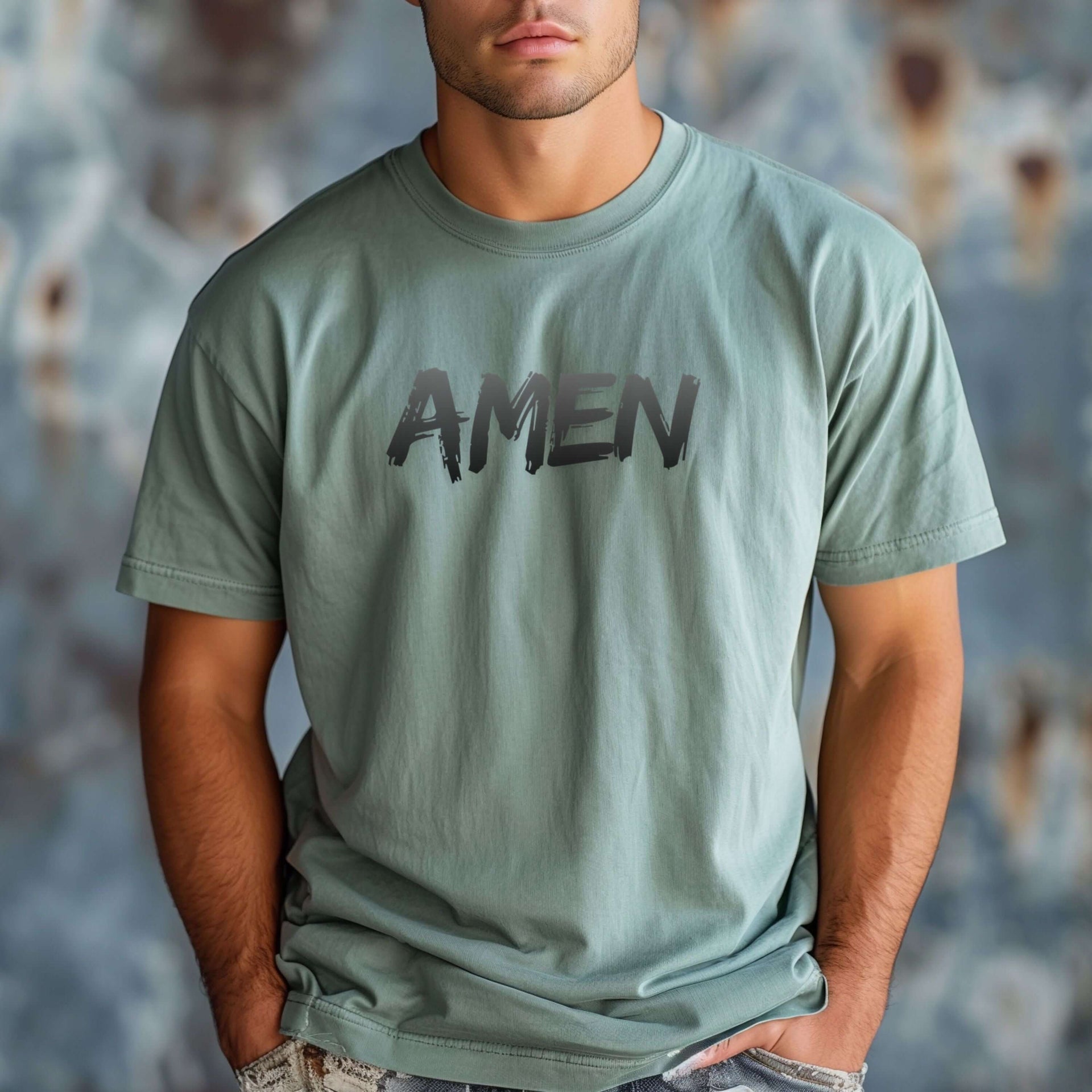 Amen Brush Stroke Text T-Shirt worn by a man in a bay color, featuring bold brush-stroke "Amen" text.