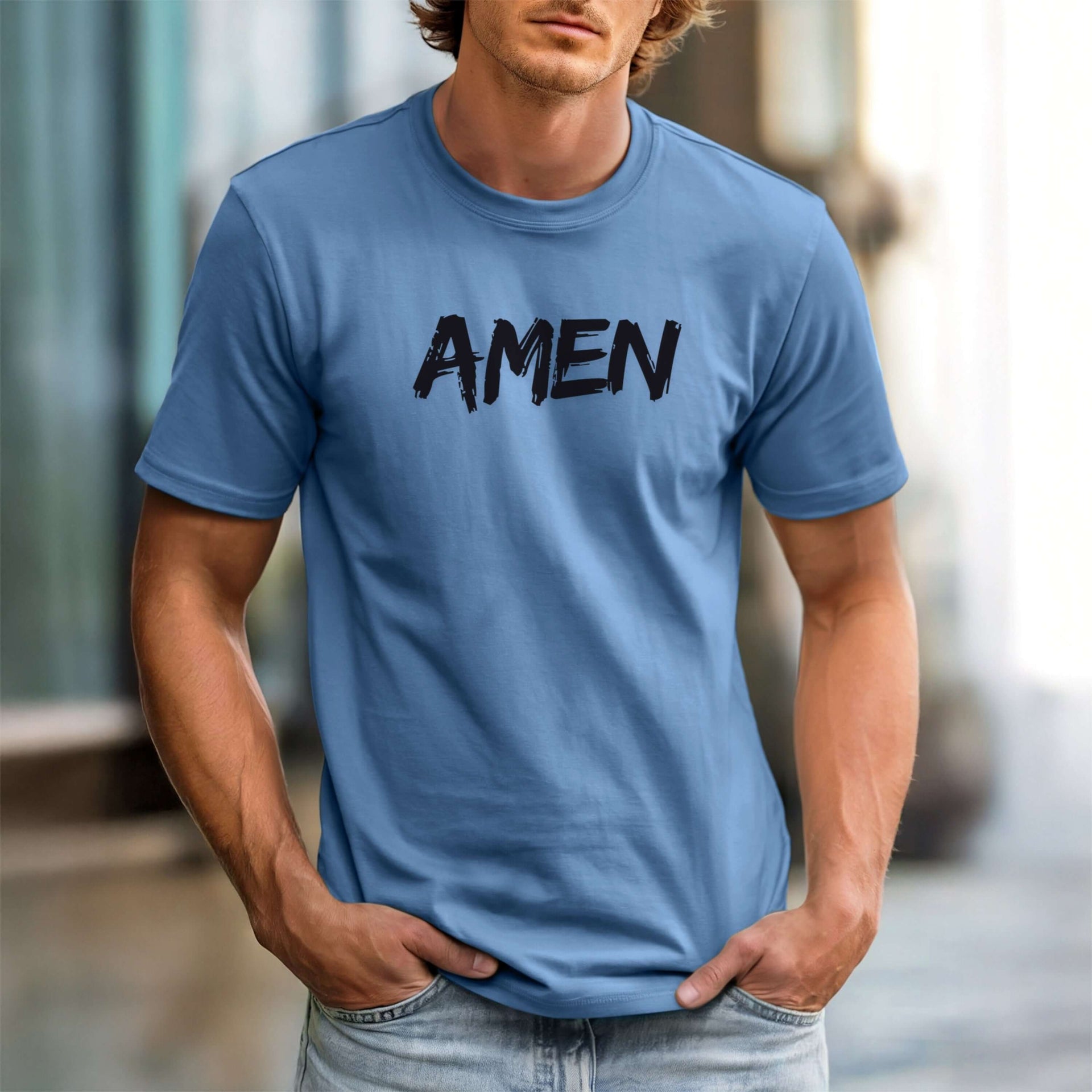 Amen Brush Stroke Text T-Shirt displayed on a model in a blue color, featuring bold brush-stroke style 'AMEN' text.