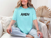 Amen Brush Stroke Unisex T-shirt displayed by a smiling woman, featuring a bold 'AMEN' graphic in black.