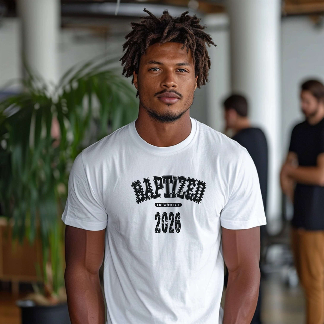 Man wearing a Baptized 2026 T-Shirt, celebrating his baptism year in a vibrant, relaxed setting.
