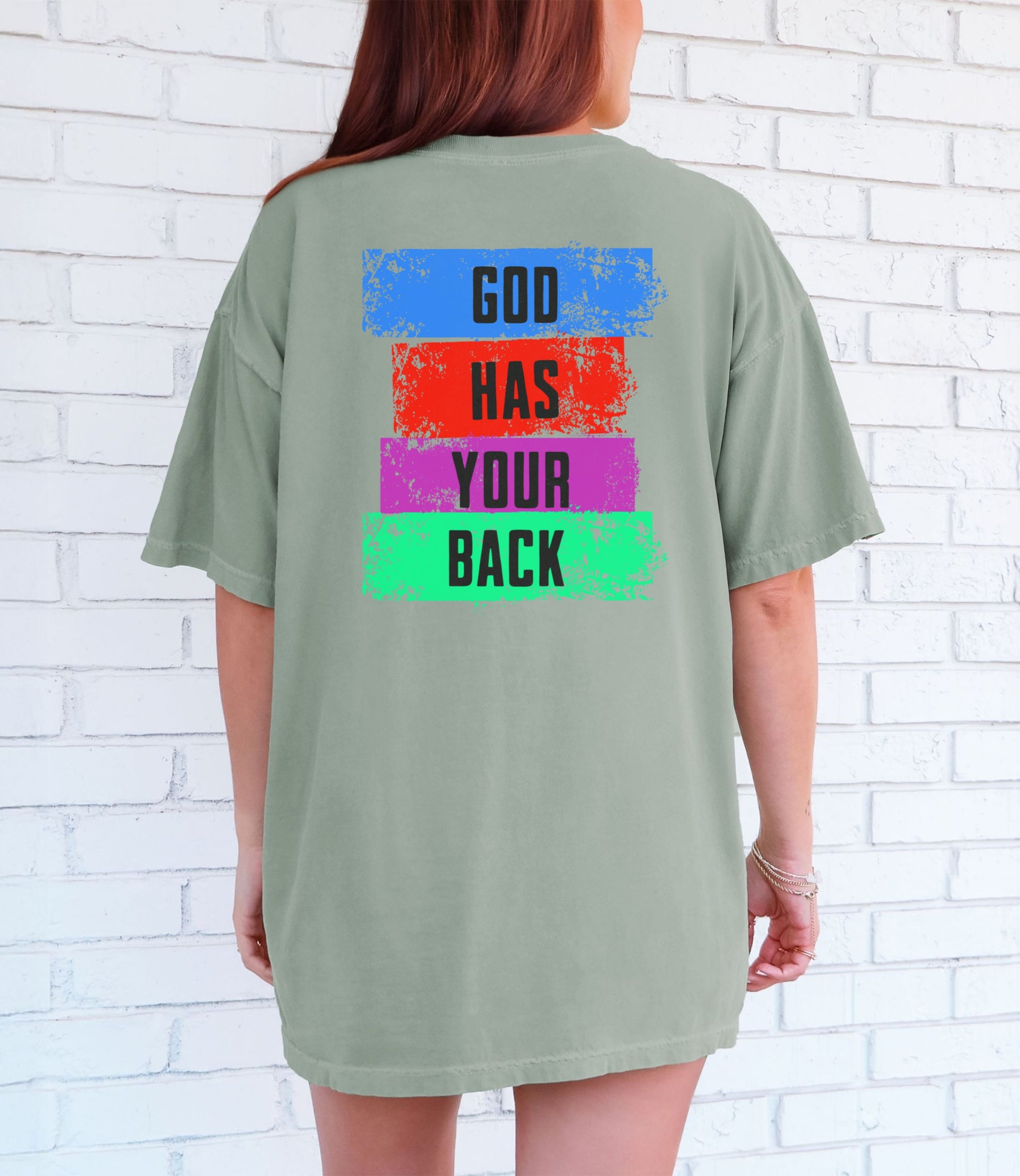 God Has Your Back T-Shirt displayed on a model, featuring a color block design in vibrant colors.