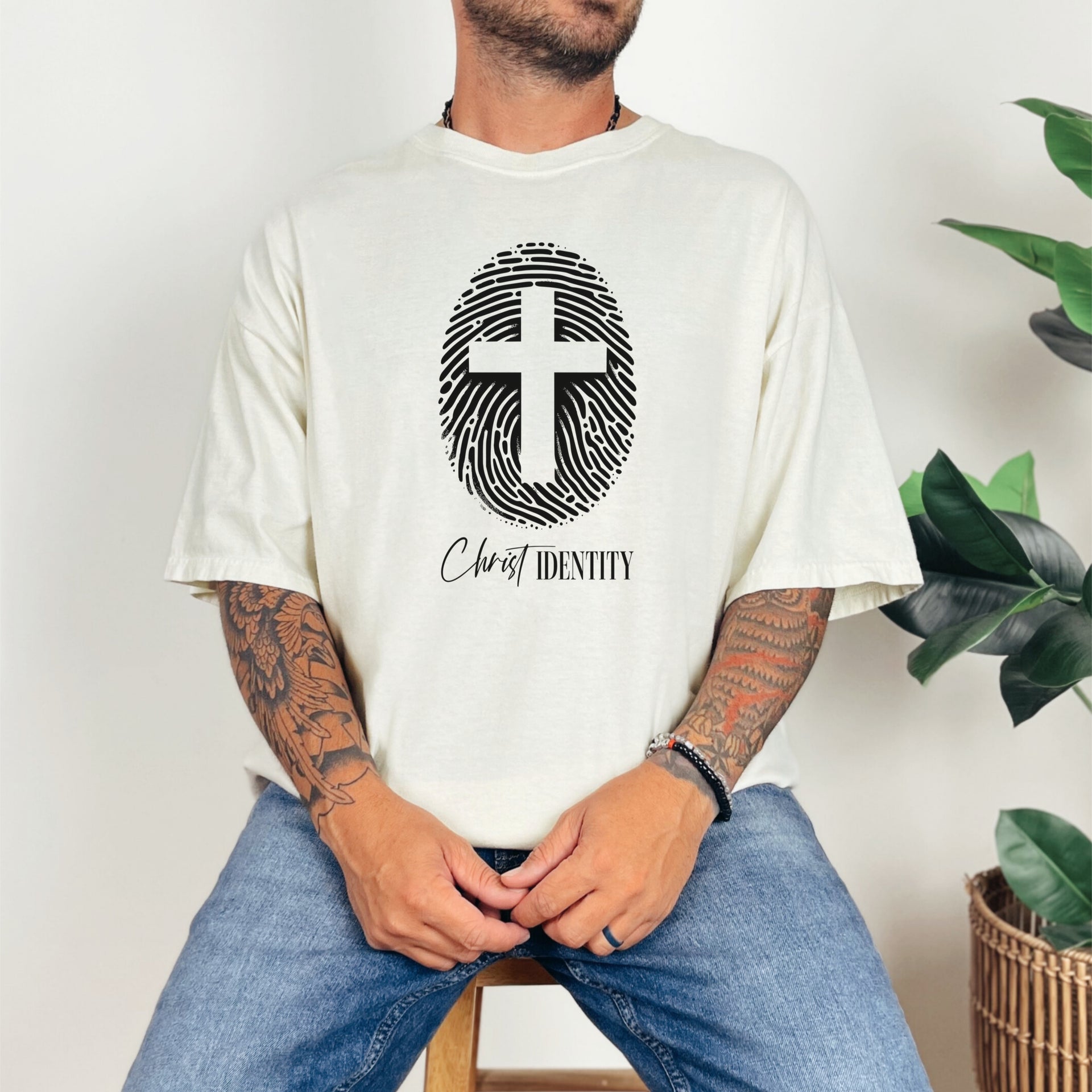 Cross Fingerprint Identity Unisex T-shirt featuring a bold fingerprint cross graphic on a ivory t-shirt.
