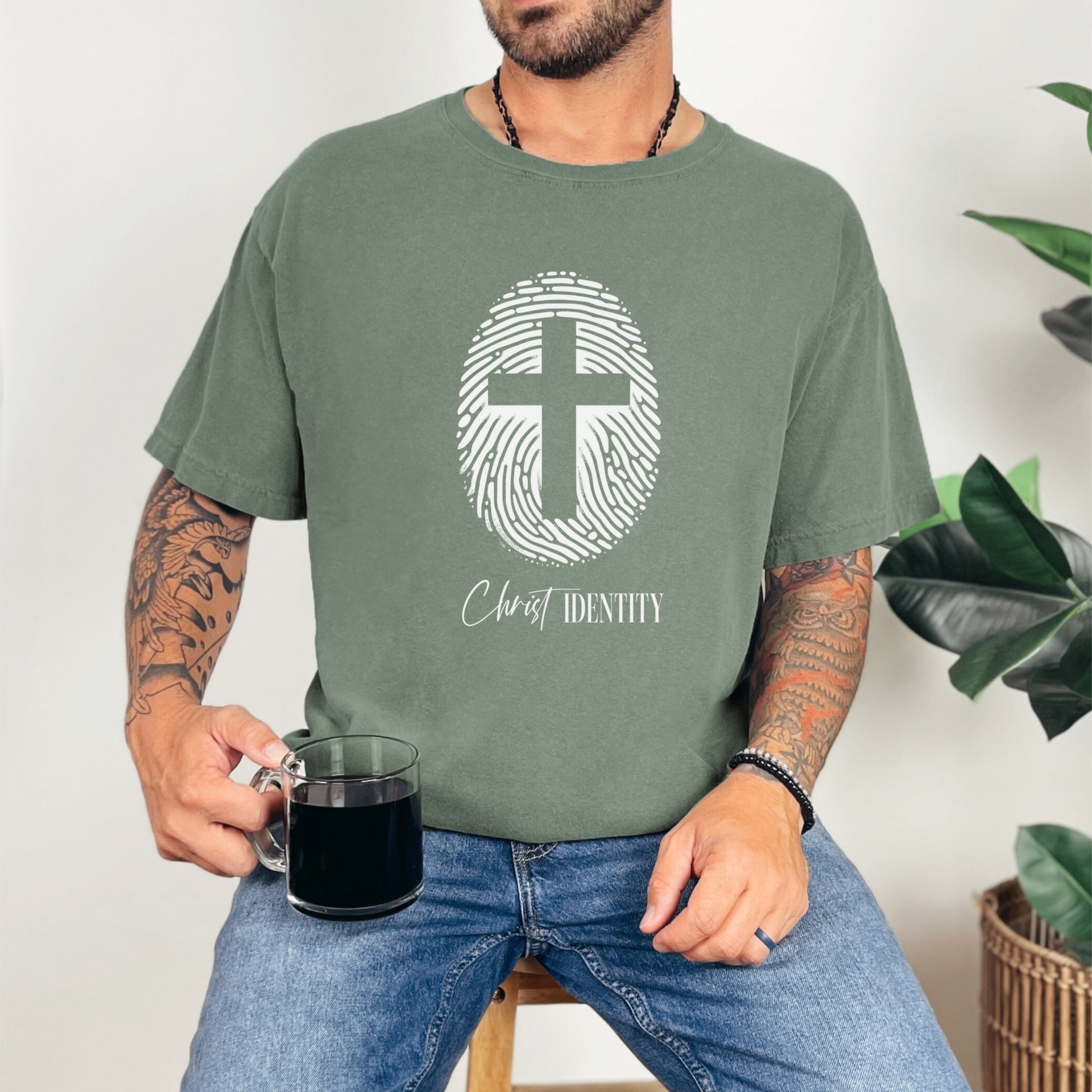Cross Fingerprint Identity Unisex T-shirt featuring a bold fingerprint cross graphic on a moss t-shirt.