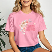 She Laughs Without Fear Of The Future Crop Tee in pink with floral design, embodying strength and confidence.