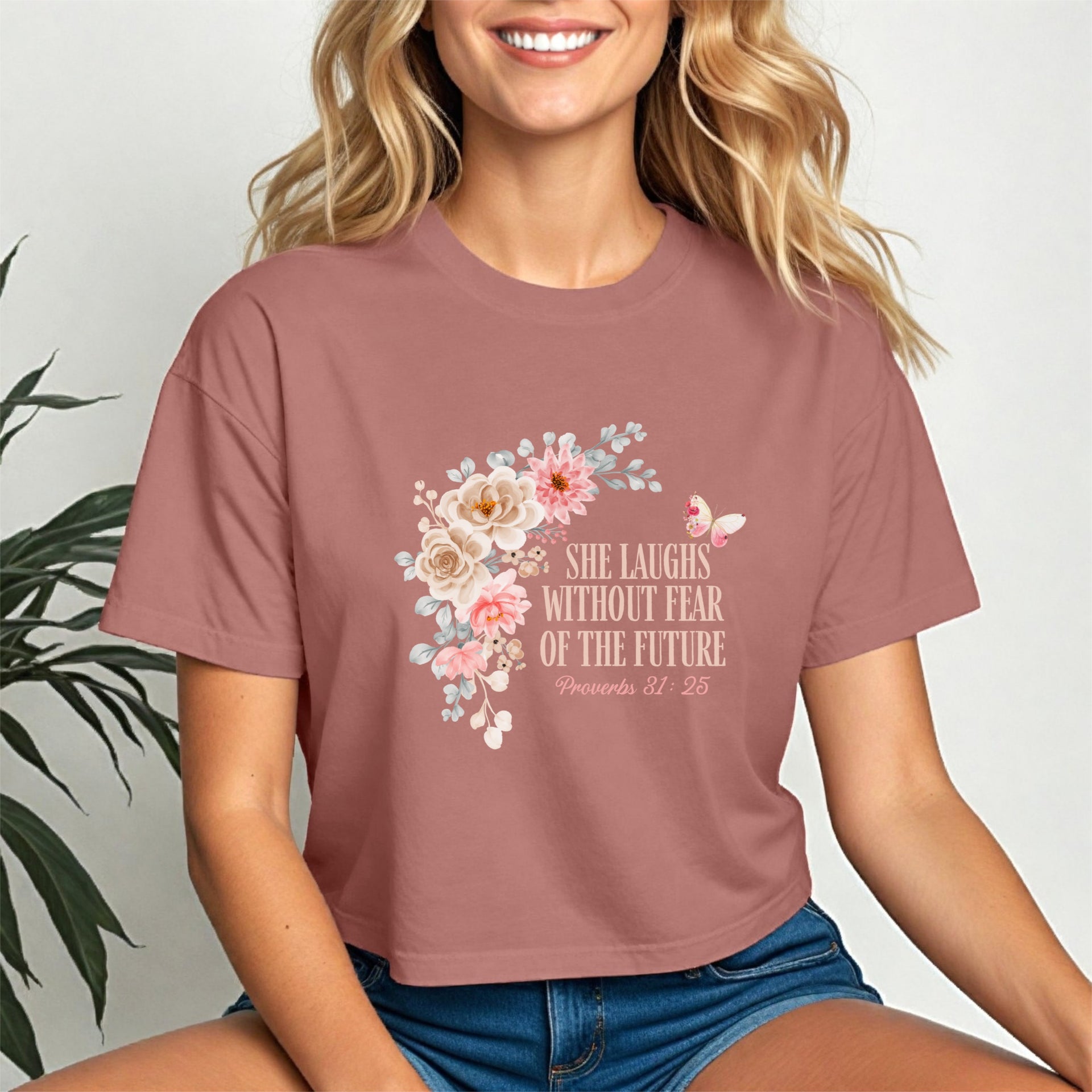 She Laughs Without Fear Of The Future Crop Tee featuring floral design and empowering message from Proverbs 31:25.