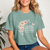 She Laughs Without Fear Of The Future Crop Tee with floral design, embodying strength and confidence.