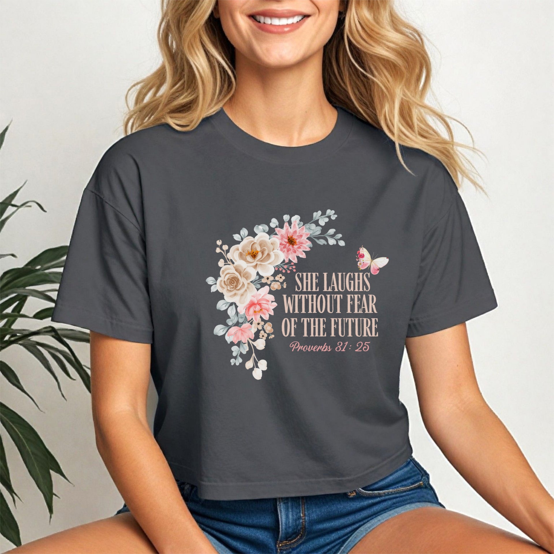 She Laughs Without Fear Of The Future Crop Tee featuring floral design and empowerment message from Proverbs 31:25.