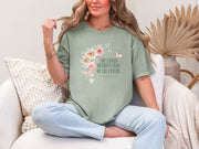 She Laughs Without Fear Of The Future Floral T Shirt on a model, showcasing floral design and a confident message.