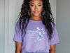 Strength And Dignity Proverbs 31 25 Butterfly T Shirt worn by a woman with a confident smile, featuring colorful butterfly design.
