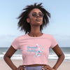 Strength And Dignity Proverbs 31 25 Butterfly Crop Tee on a model at the beach, showcasing confidence and grace.