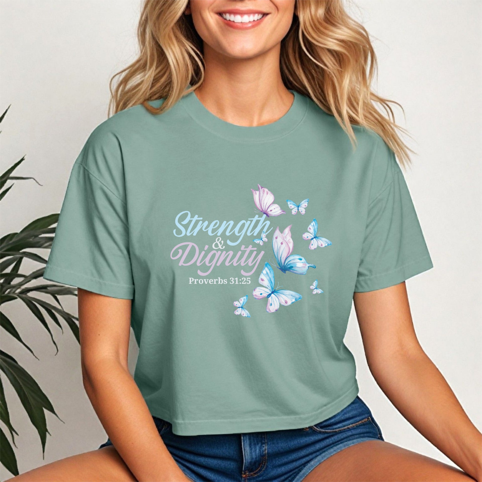 Strength And Dignity Proverbs 31 25 Butterfly Crop Tee featuring a butterfly graphic on a green crop tee.