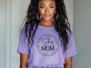 Girl wearing She Is Mom Circle Script T Shirt with a positive message design.