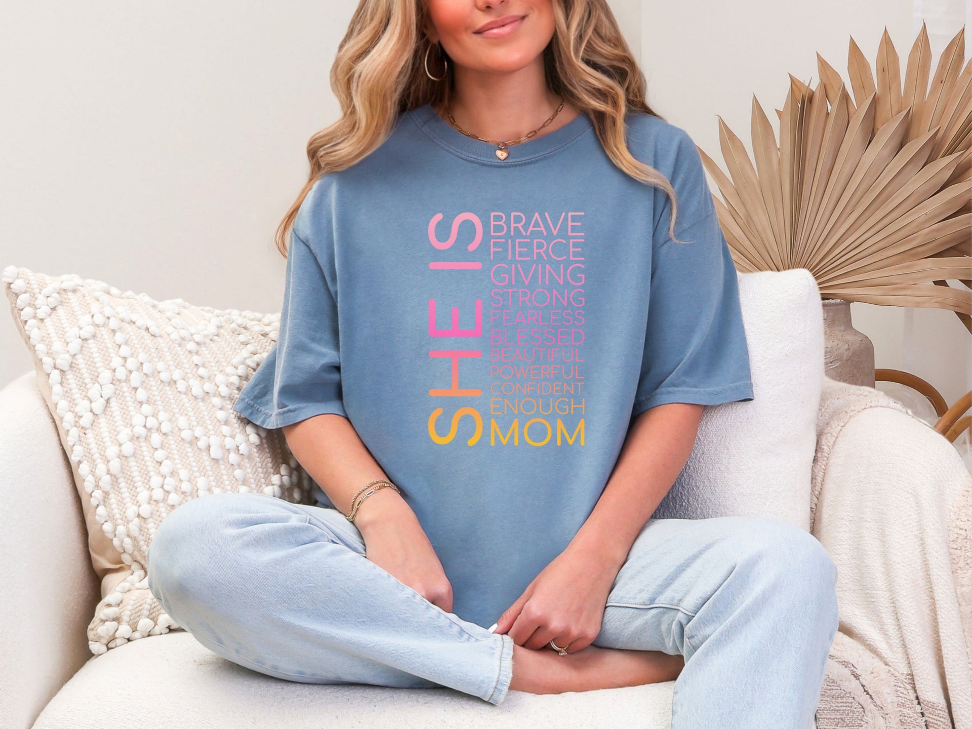 SHE IS vertical affirmation mom T-Shirt worn by a woman, showcasing vibrant positive affirmations for moms.