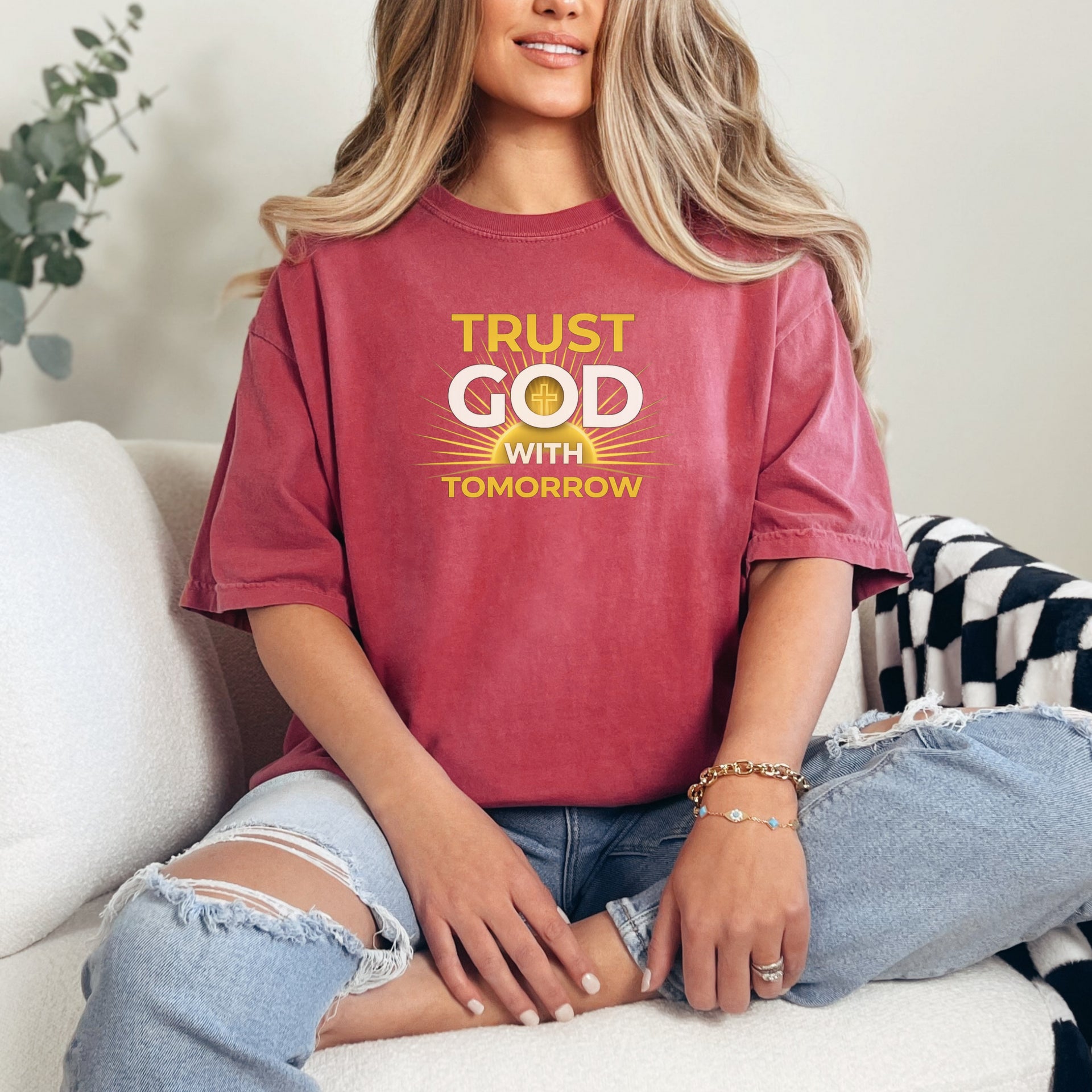 Trust God With Tomorrow T-Shirt worn by a woman, featuring a positive message in a relaxed setting.