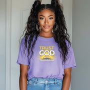 Trust God With Tomorrow T-Shirt featuring a woman wearing a purple shirt with the message displayed.