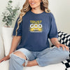 Woman wearing a blue Trust God With Tomorrow T-Shirt, promoting faith and confidence with a stylish design.