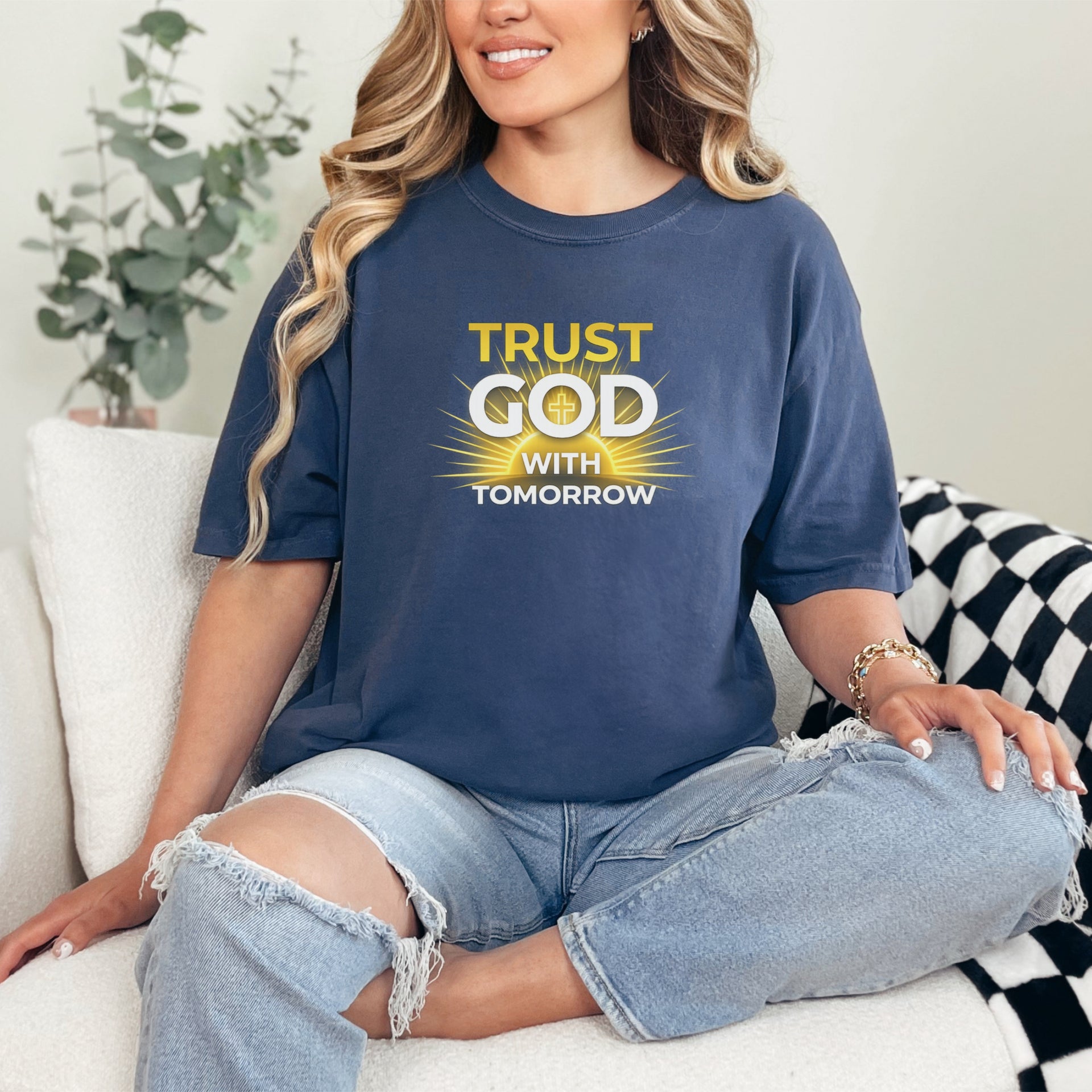 Woman wearing a blue Trust God With Tomorrow T-Shirt, promoting faith and confidence with a stylish design.