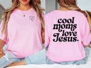 Cool Moms Love Jesus T Shirt displayed in pink, featuring heart design on front and bold text on back.