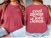 Cool Moms Love Jesus T Shirt featuring heart design, soft fabric, and unisex fit, perfect for mothers celebrating faith.