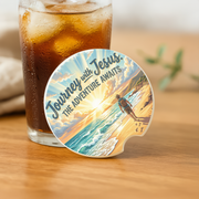 Journey With Jesus Adventure Awaits Car Coaster featuring a serene beach scene and inspirational message.