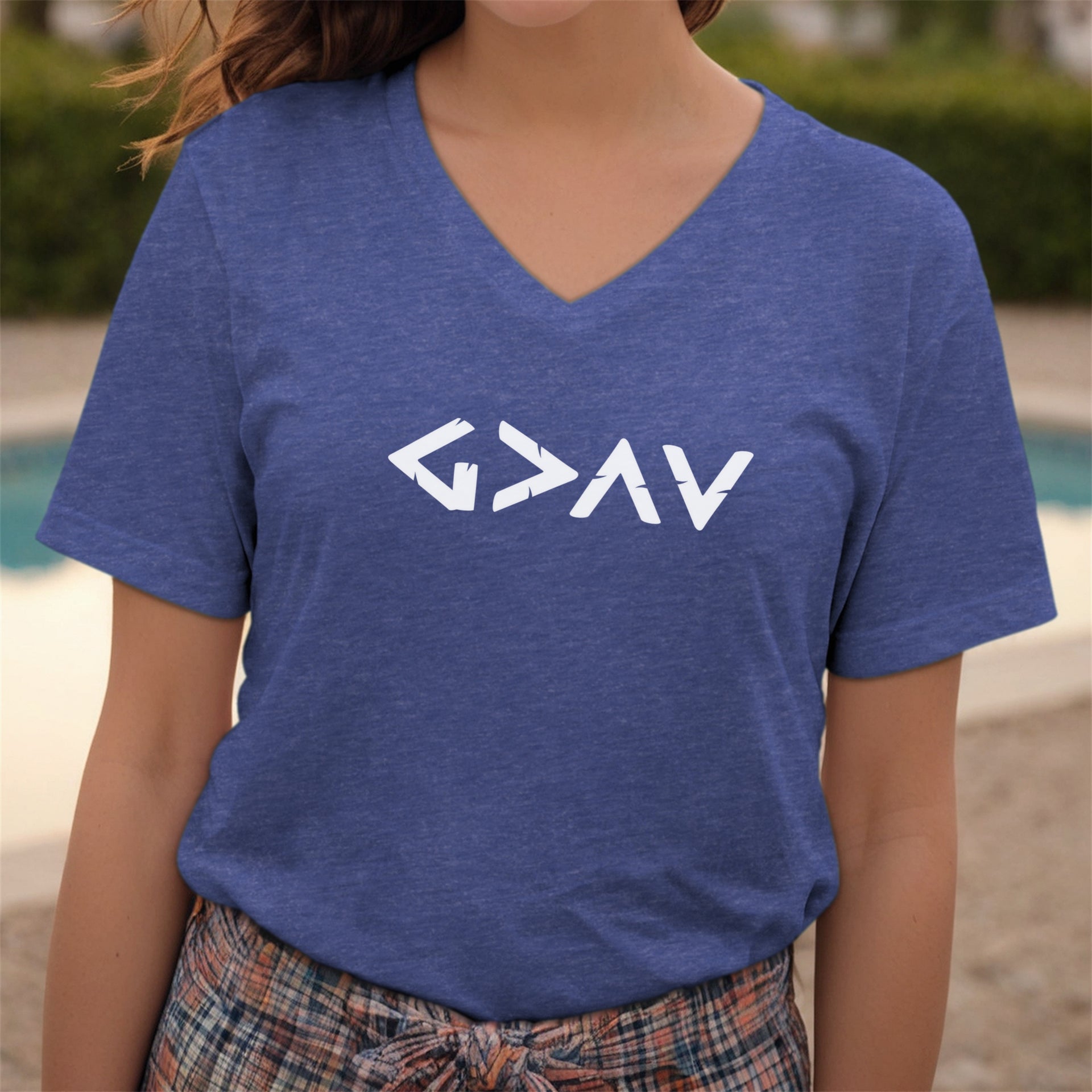 Model wearing a God Is Greater Than Highs And Lows V Neck Tee with a geometric symbol design.