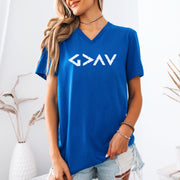 God Is Greater Than Highs And Lows V Neck Tee in royal blue worn by model with a minimalist geometric design.