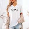 God Is Greater Than Highs And Lows V Neck Tee with minimalist design, worn by a model in a cozy sweater.