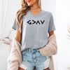 Model wearing God Is Greater Than Highs And Lows V Neck Tee in athletic heather, showcasing minimalist design with geometric symbol.
