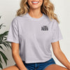Woman wearing This Mama Prays Christian Crop Tee for Moms, showcasing faith and style in casual wear.