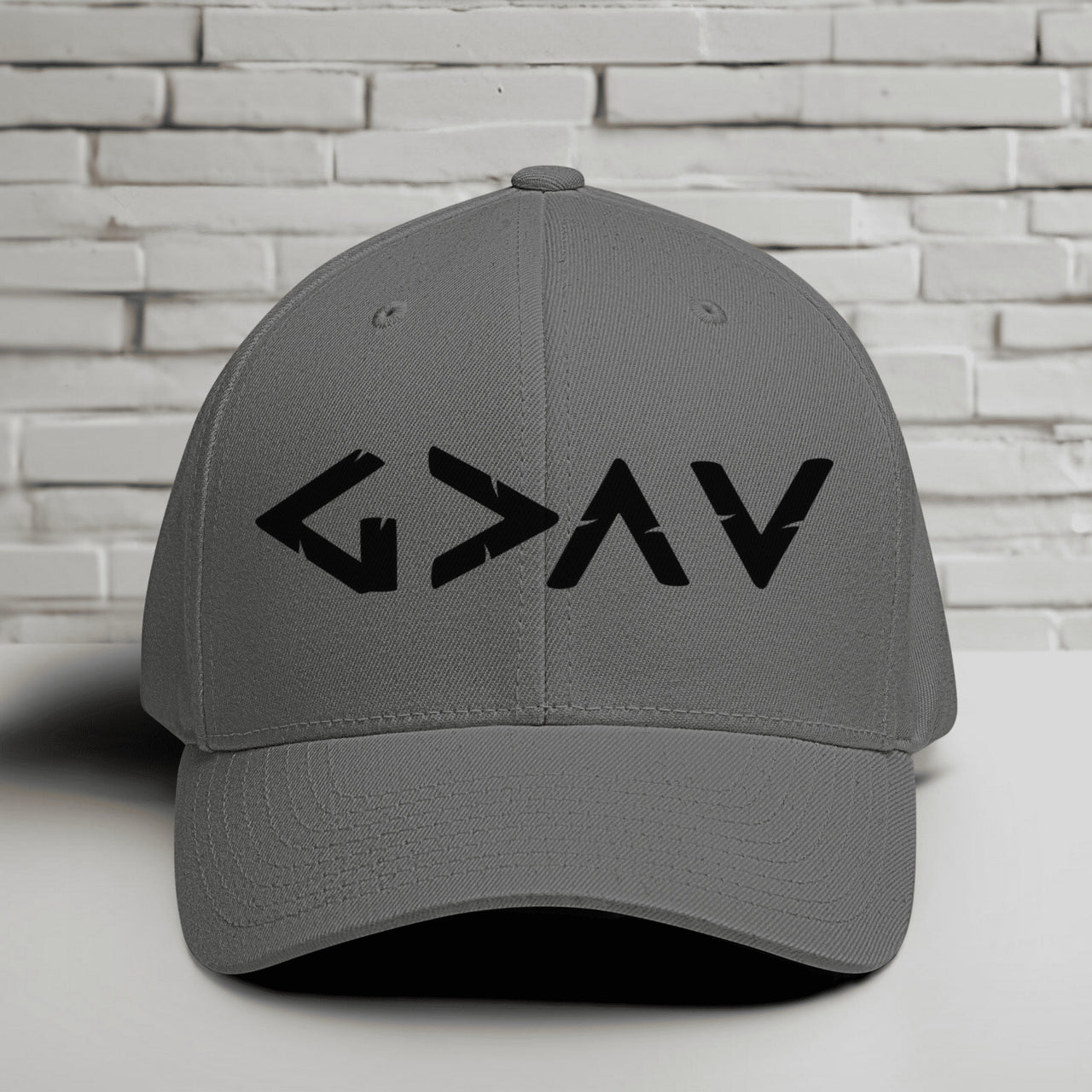 God is Greater Than Highs and Lows Embroidered Flexfit Hat in grey with black lettering
