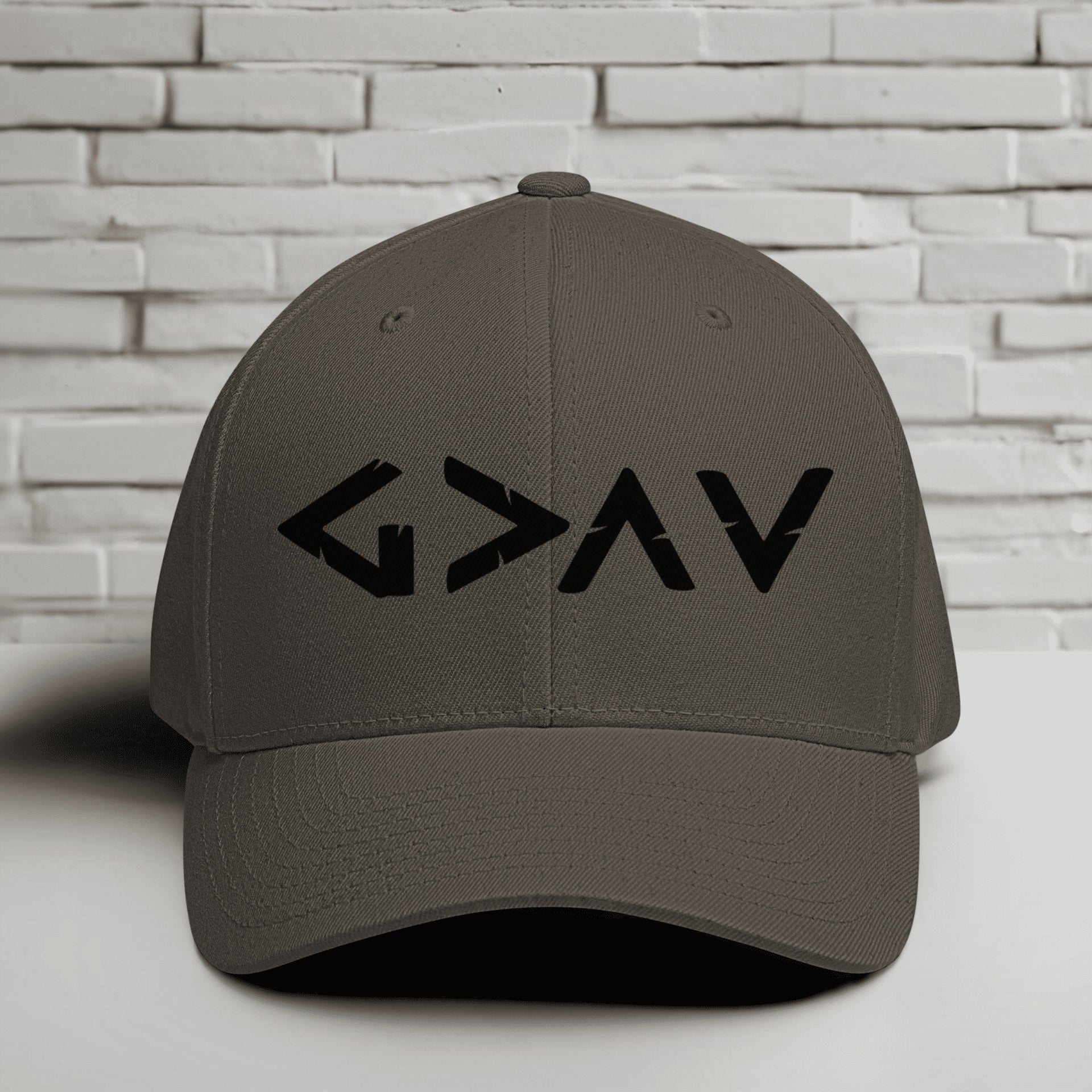 God is Greater Than Highs and Lows Embroidered Flexfit Hat in gray with bold lettering