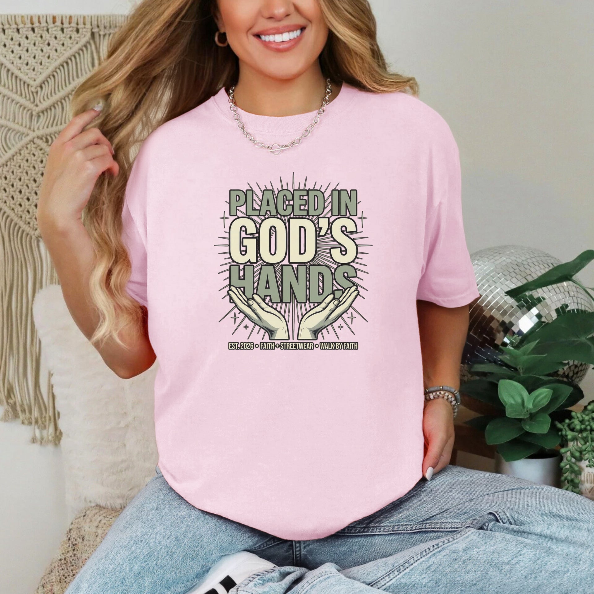 Placed in God's Hands T-Shirt worn by a woman with a joyful expression, illustrating faith and comfort.